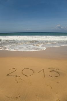 new 2013 year numbers drawings in the sand on the beach