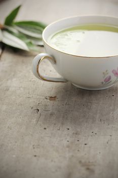 Cup of tea on wood board, drink for health