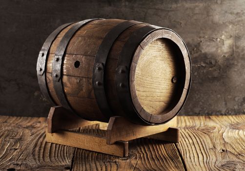 Old wine barrel on wooden table
