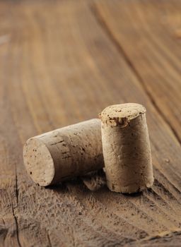 Corks on a wooden table, close up, copy space