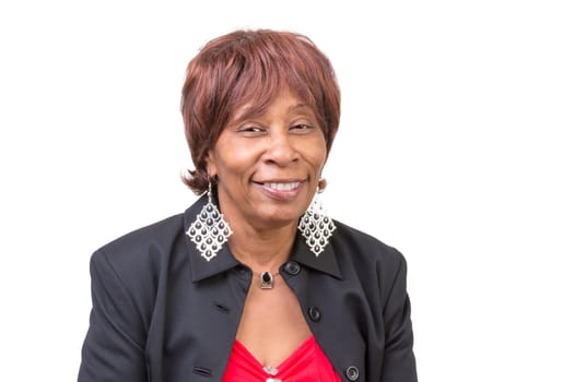 Woman giving a big trusty and toothy smile with her big ear rings.