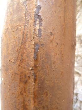 old rusty pipe in sunlight as a background