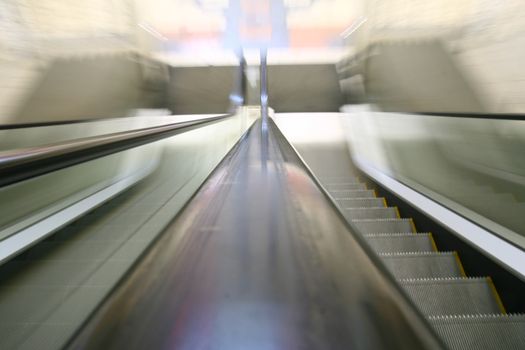 escalator transportation motion blured business background 