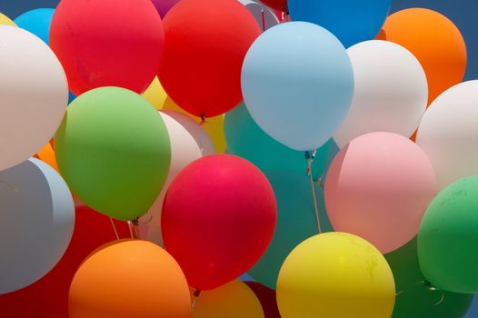 Countless colorful balloons flying in deep blue sky