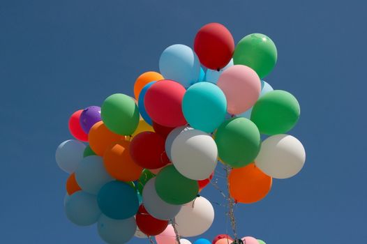 Countless colorful balloons flying in deep blue sky