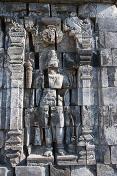 Images of damaged Boddhisattva on stone wall of Perwara (guardian) temple in Candi Sewu complex (means 1000 temples). It has 253 building structures (8th Century) and it is the second largest Buddhist temple in Java, Indonesia.