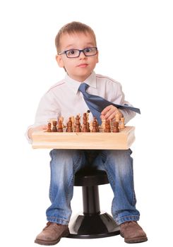 Serious kid playing chess, isolated on white background. 