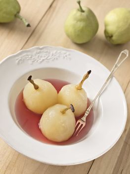 close up of a plate of poached pears