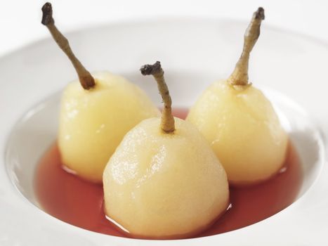 close up of a plate of poached pears