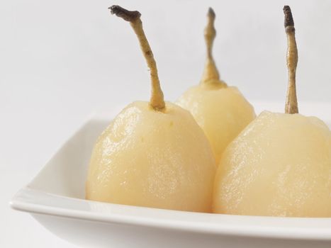 close up of a plate of poached pears