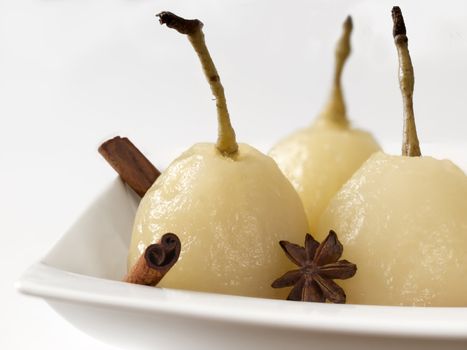 close up of a plate of poached pears
