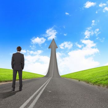 Concept of the road to success with a businessman standing on the road