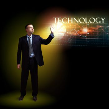 Businessman standing with modern technology symbols next to him