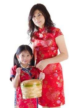 Oriental family in chinese red cheongsam dress, celebrating Chinese new year, isolated on white background