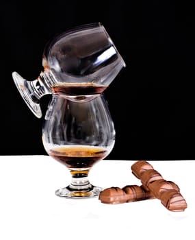 Crystal glass with cognac, chocolate 