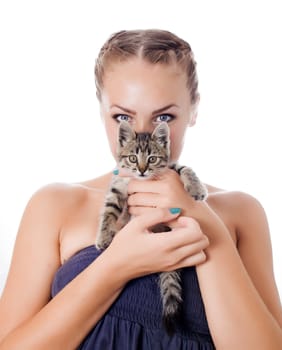 Portrait of a cute girl with a kitten against white background