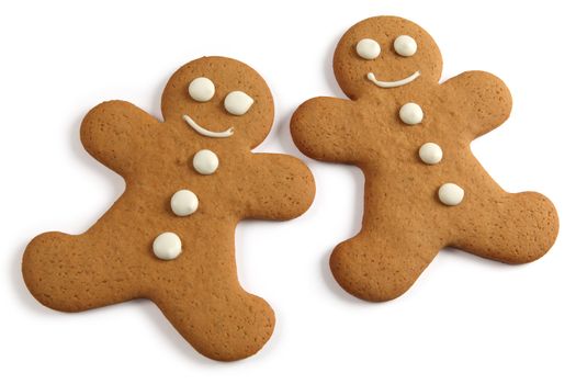 Photo of two baked gingerbread man cookies on a white background. Clipping path included.