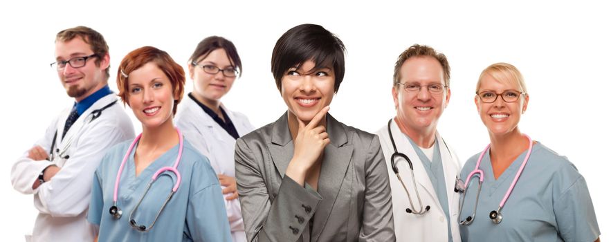 Young Mixed Race Woman with Doctors and Nurses Behind Isolated on a White Background.