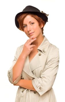 Attractive Red Haired Girl Wearing a Trenchcoat and Hat Isolated on a White Background.
