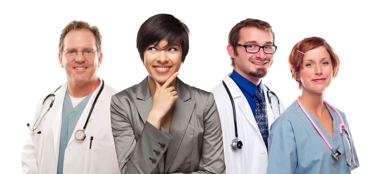 Young Mixed Race Woman with Doctors and Nurses Behind Isolated on a White Background.