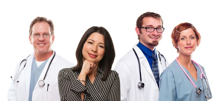 Attractive Hispanic Woman with Male and Female Doctors or Nurses Isolated on a White Background.