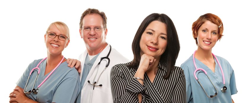 Attractive Hispanic Woman with Male and Female Doctors or Nurses Isolated on a White Background.