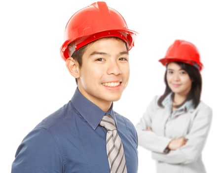 A man and a woman wearing hardhats (on white)