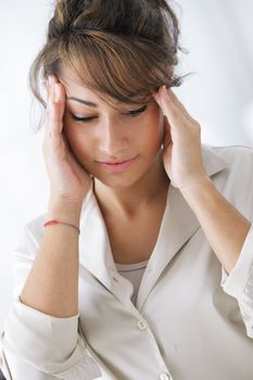 Young businesswoman has a headache