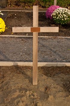 Cemetery Cross on a Graveyard with All Saints Day