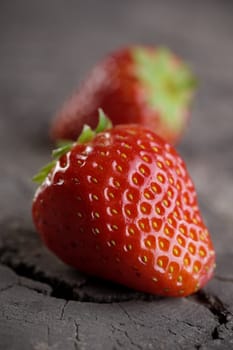 Fresh strawberries on old wooden background