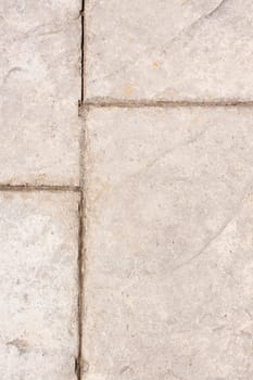 A stone checkerboard background texture detail from a sidewalk.