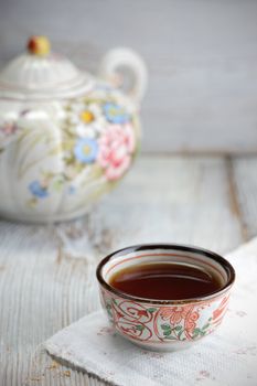 Cup of tea on wood board, drink for health