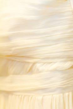 A detail image of a wedding dress before the marriage ceremony.