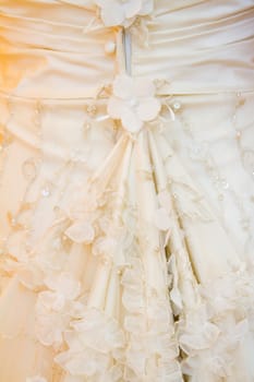 A detail image of a wedding dress before the marriage ceremony.