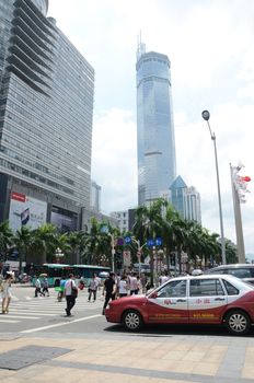 SHENZHEN, CHINA - SEPTEMBER 6: Unidentified group of people walk along HuaQiang Lu - famous shopping street in Shenzhen on September 6, 2012.