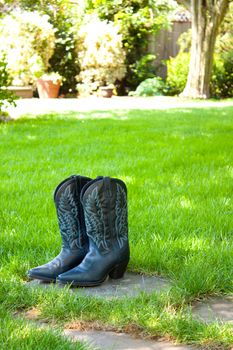 A bride is going to put on these cowboy boots and wear them for her wedding.