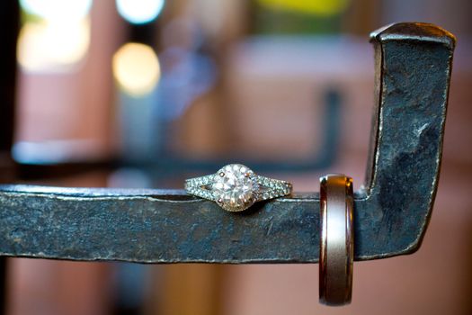 A bride and groom wedding rings photographed in an artistic wedding pictures sort of way with nobody in the image.