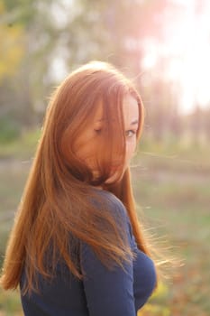 portrait of cute red haired young woman, outdoor