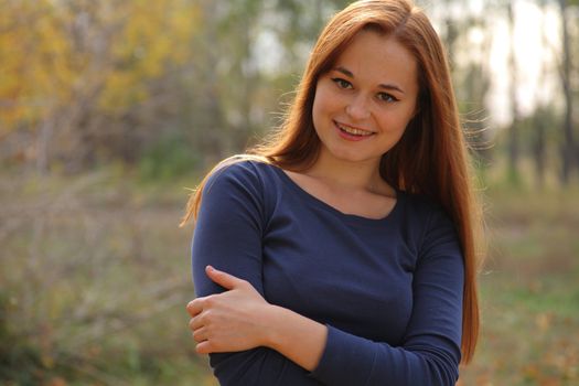 portrait of cute red haired young woman, outdoor