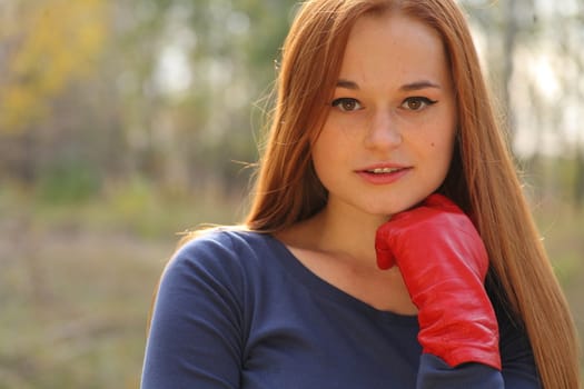 portrait of cute red haired young woman, outdoor