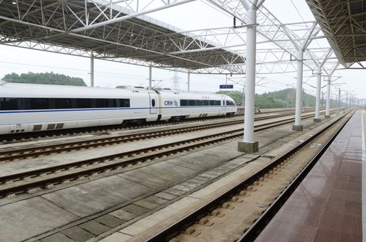 YUEYANG, CHINA - SEPTEMBER 9:  Fast train between Shenzhen and Wuhan stops in YueYang railway station on September 9, 2012. 