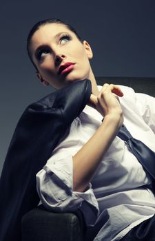 Sensual woman portrait, fashion model with man's suit