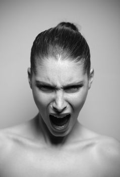 Beautiful woman shouting angry, shallow deep of field