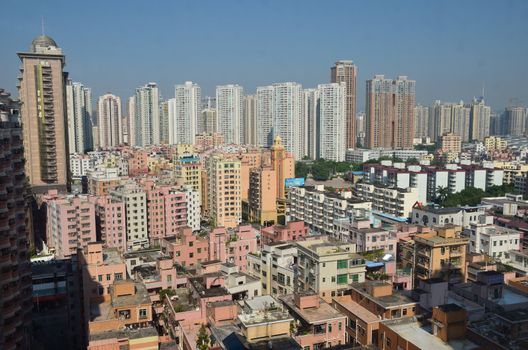 SHENZHEN, CHINA - SEPTEMBER 16:  Modern Shenzhen city, Futian district with new and old residential buildings on September 16, 2012. Within 30 years Shenzhen became modern business metropolis.