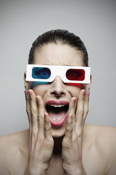 Scared woman watching a horror 3d movie 