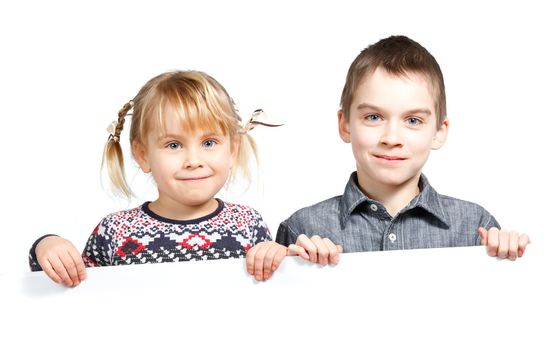 Sister and brother holding a white board