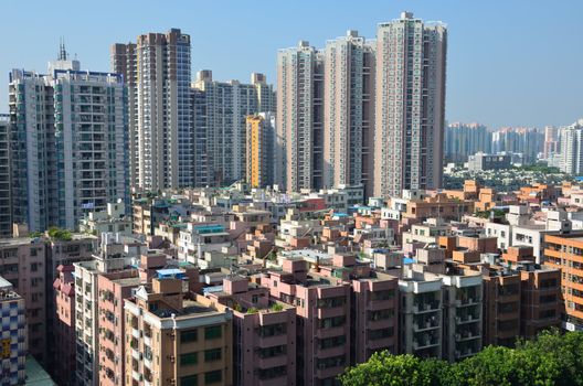 SHENZHEN, CHINA - SEPTEMBER 16:  Modern Shenzhen city, Futian district with new and old residential buildings on September 16, 2012. Within 30 years Shenzhen became modern business metropolis.