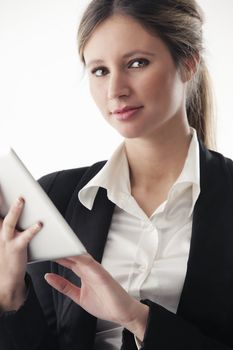 Portrait of young business woman working on digital tablet
