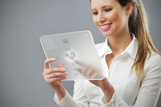 Portrait of smiling young business woman working on her innovative digital tablet