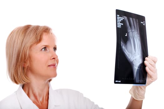 Female doctor looking at an x-ray over a white background